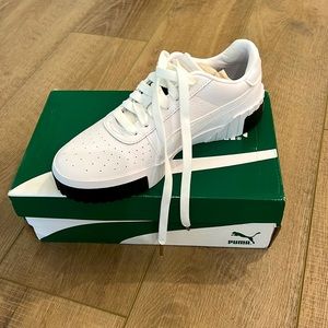 White puma sneakers with black trim size 9